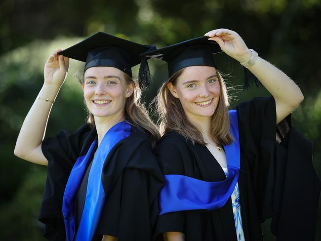 Twin sisters Erin and Maddy Menzies graduated from a Bachelor of Business (management and innovation / marketing). Picture: David Caird