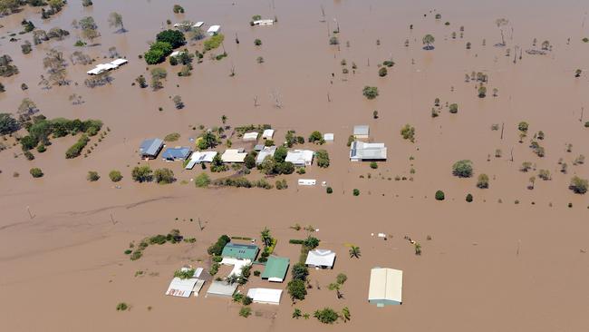 Homes are inundated with floodwater on Fairymead Road in Bundaberg. Picture: AAP