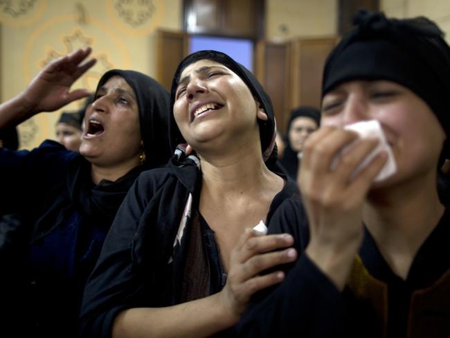 Relatives of killed Coptic Christians grieve during their funeral at Abu Garnous Cathedral in Minya, Egypt, Friday, May 26, 2017. Picture: AP.