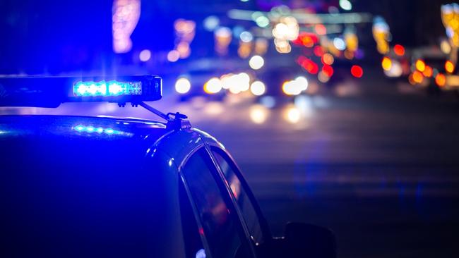 Police car lights at night. Photo: RACQ.