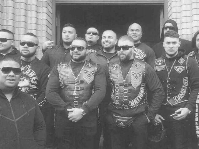 Pitasoni Ulavalu (centre rear) pictured with other senior Australian gang office holders, was stabbed and killed at Kokomo's night club in Canberra