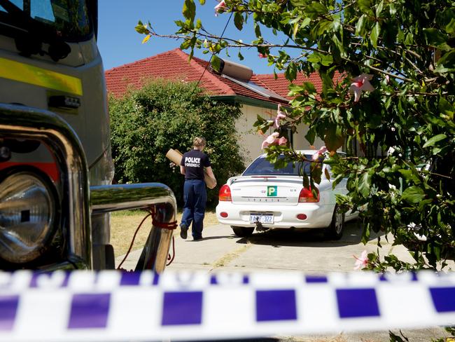 Police search the house at Kewdale. Picture: AAP Image/Richard Wainwright