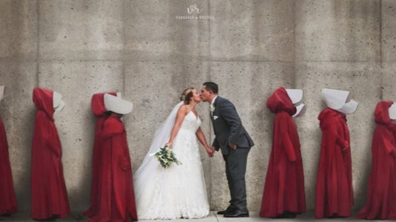 This Handmaid’s Tale-inspired wedding photo was slammed as ‘tone deaf’ by outraged social media users. Picture: Van Daele &amp; Russell Photography.