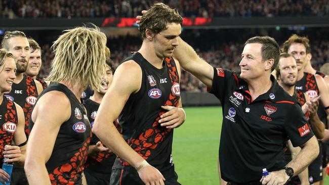 John Worsfold congratulates Joe Daniher on winning the Anzac Medal. Picture: Wayne Ludbey