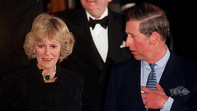 Prince Charles and his then companion Camilla Parker Bowles leave the Ritz Hotel in London in 1999, the first time the couple appeared together in public.