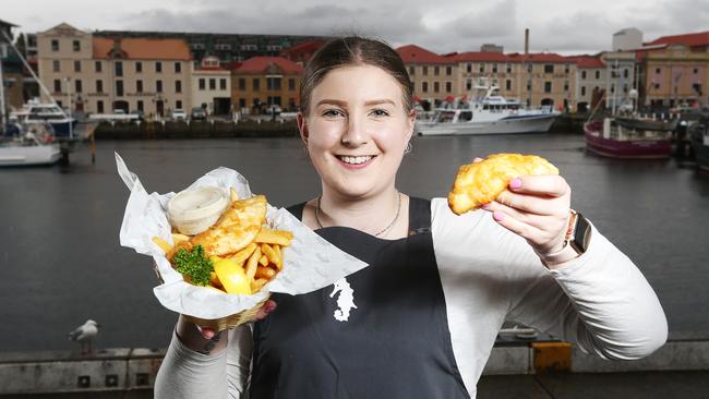 Duty manager from Mures Chloe Doddridge with their signature dish Australian line caught blue eye trevalla as they have been voted in the top ten Tasmania fish and chip shops. Picture: Zak Simmonds