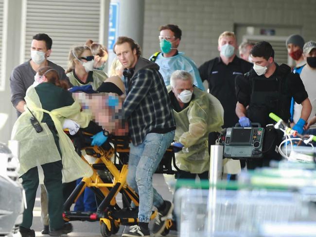 A man has been fatally shot by police officers and shoppers are understood to have suffered life-threatening injuries in horrific scenes at a West Auckland supermarket this afternoon.Emergency services responded to the New Lynn mall mid-afternoon, with multiple people being injured. The Herald has been told at least one person suffered a stab wound, while Newstalk ZB understands two people have been shot.Four people have been taken to Auckland City Hospital's emergency department. It is understood the patients are all status 1 - which is in an immediately life-threatening condition.New Zealand Herald photograph by Alex Burton