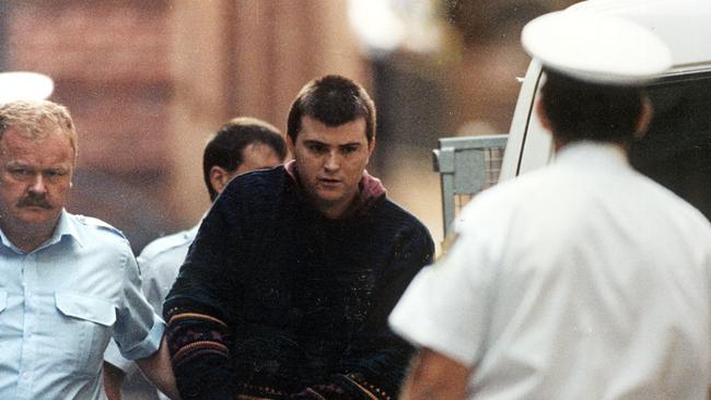 Frankston serial killer Paul Denyer being taken away by police in 1993.