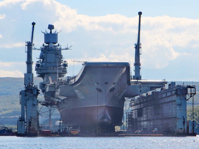 Russia's aircraft carrier Admiral Kuznetsov in the drydock that has sunk, causing the two cranes to collapse. Picture: Russian MoD