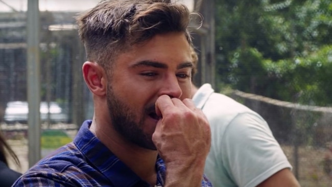 Zac Efron tastes local cuisine in a still from his program