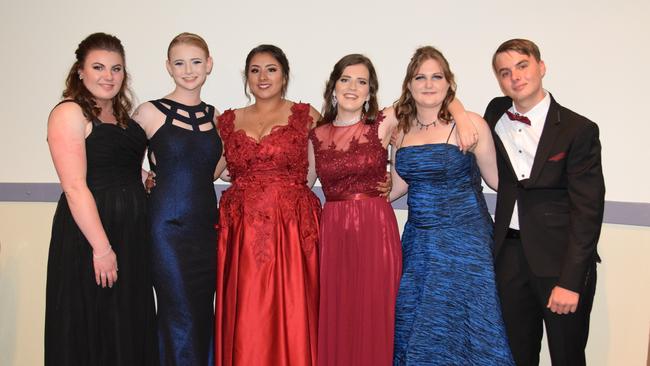(From left) Demi Grayson, Alydia Edmunds, Charlee Elliott, Emily Clark, Rechelle Parsons and Joshua Hardwick at the Warwick State High School formal on November 15, 2018.