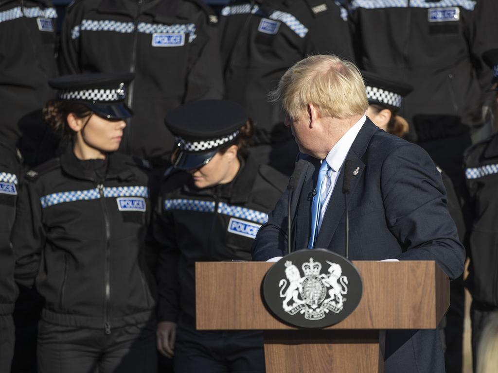 Mr Johnson reacts as a woman needs to sit down during a speech. It was later criticised by police who claimed they were “hijacked” as a backdrop for a political exercise. Picture: Danny Lawson — WPA Pool/Getty Images.