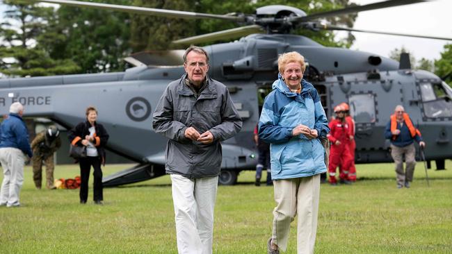 Relief: Tourist evacuees who were airlifted from Kaikoura by the New Zealand Airforce walk to the Red Cross centre at Woodend, Christchurch. Picture: AFP/Marty Melville