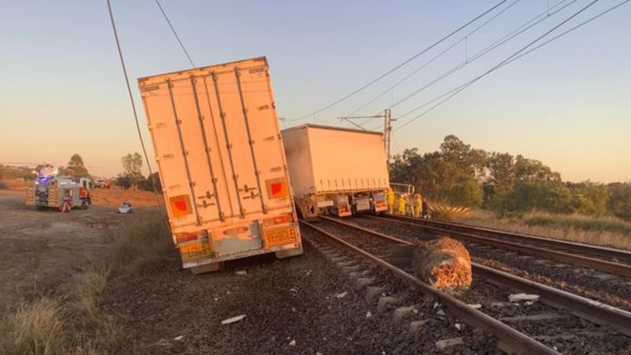 It took two days for the truck to cleared and the train tracks to be reopened. Photos: QPS