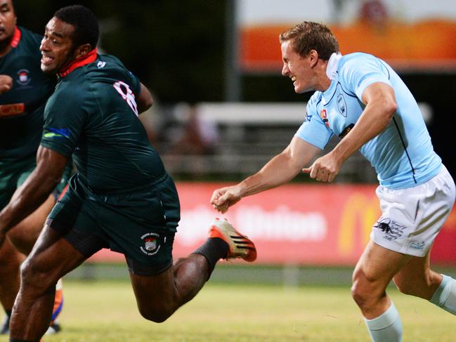 NT Rugby Union South Darwin vs Casuarina: Southern Darwin player Lepani Nabuliwaqa breaks away from Casuarina player Shane Crowley