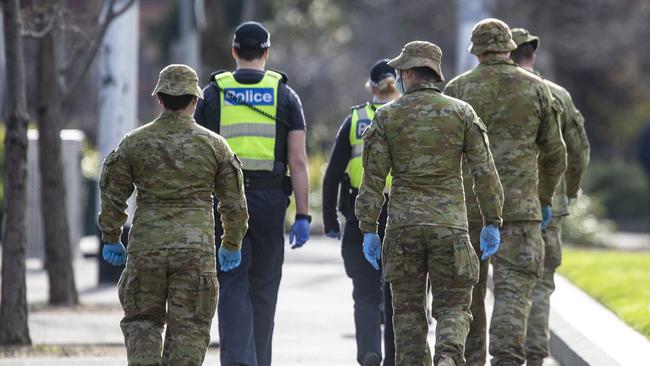 Victorian Police and Australian Defence Force members patrol Melbourne’s streets. Picture: NCA NewsWire / Sarah Matray