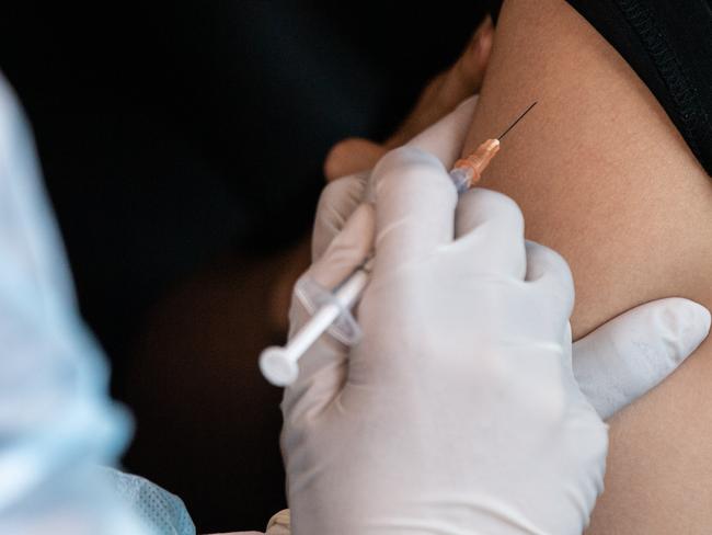 SYDNEY, AUSTRALIA - NewsWire Photos September 24, 2021: Medical staff administering COVID-19 Vaccinations at the Drive-Through COVID-19 Vaccination Hub at Belmore Sports Ground, Sydney. Picture: NCA NewsWire / James Gourley