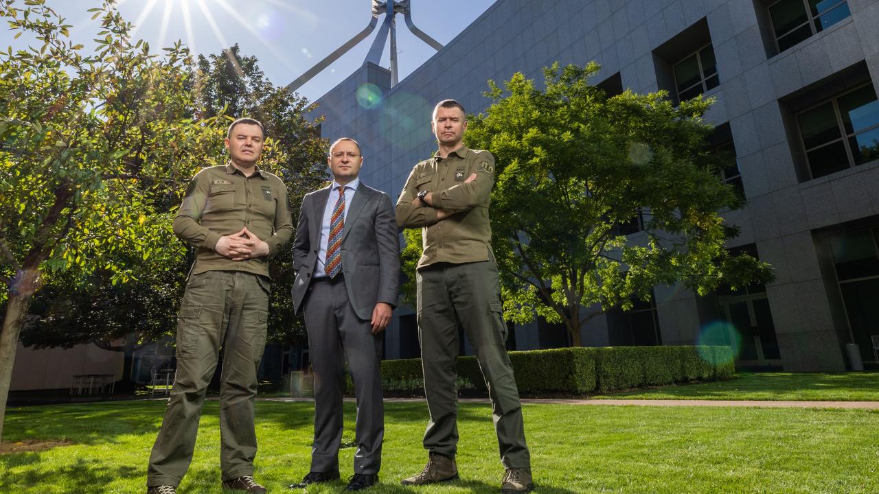 Ukrainian Ministry of Defence personnel Gennadiy Kurochka with Ukraine's Ambassador to Australia Vasyl Myroshnychenko and Dr Yuriy Sak, at Parliament House in Canberra after talks for more military aid. Picture: NCA NewsWire / Gary Ramage