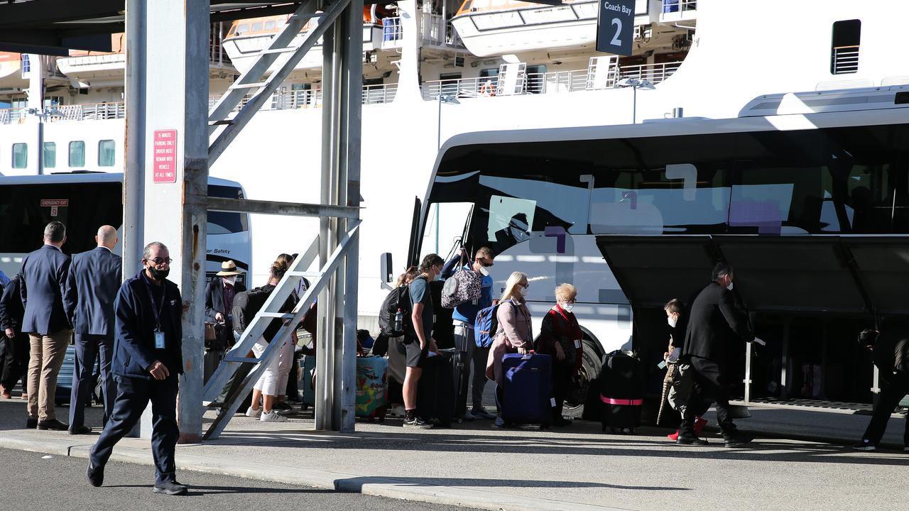 Passengers load their luggage onto buses before getting dropped home on Monday. Picture: NCA NewsWire / Gaye Gerard