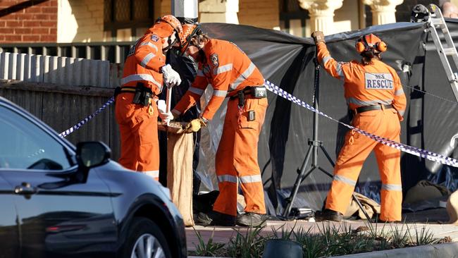 SES workers examine the scene at Alabama Ave, Prospect. Picture: AAP / Mike Burton