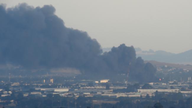 Thick black smoke from the fire. Picture: Tony Gough