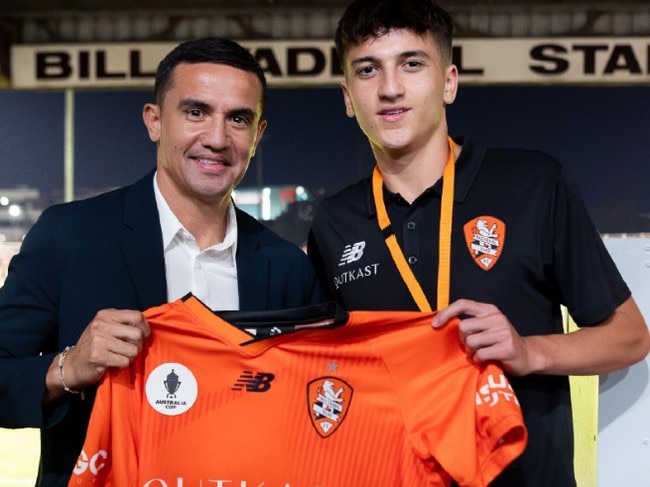 Shae Cahill with dad Tim when he signed with the Roar. Picture: Brisbane Roar
