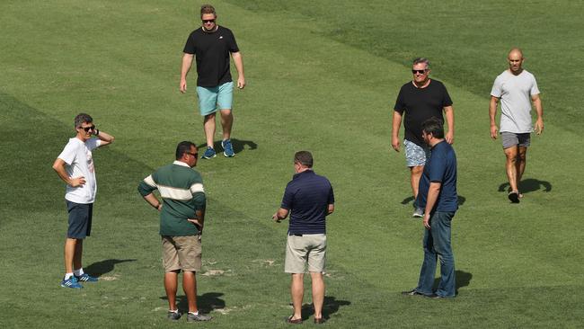 NRL head of football operations Graham Annesley, Nathan McGuirk and Roosters and Souths representatives inspect the SCG after the Waratahs game on Saturday last night. Picture: Brett Costello