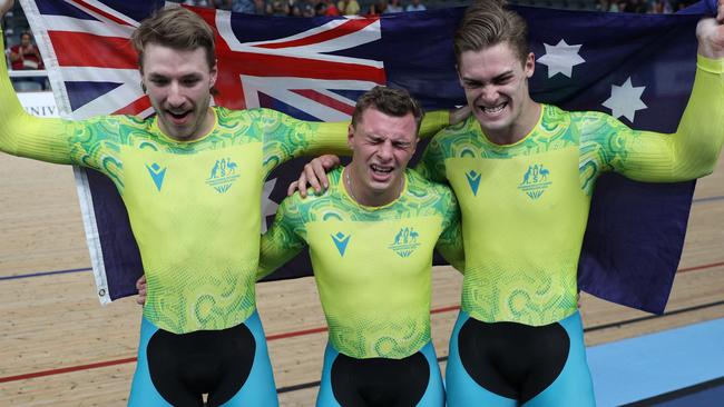 Leigh Hoffman, Matthew Richardson and Matthew Glaetzer celebrate winning the gold medal in the men's team sprint final. Picture: Adrian Dennis/AFP