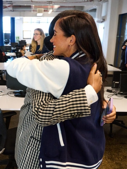 Meghan hugged a student during a visit to the Marcy Lab School, a partner of The Archewell Foundation, in October. Picture: Archewell Foundation