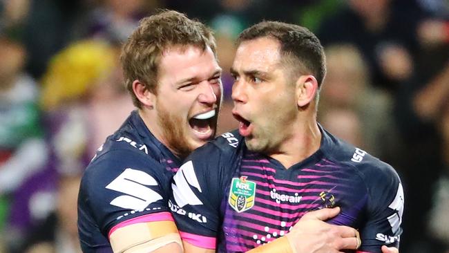 Tim Glasby and Cameron Smith celebrate the Storm’s 2017 premiership success.