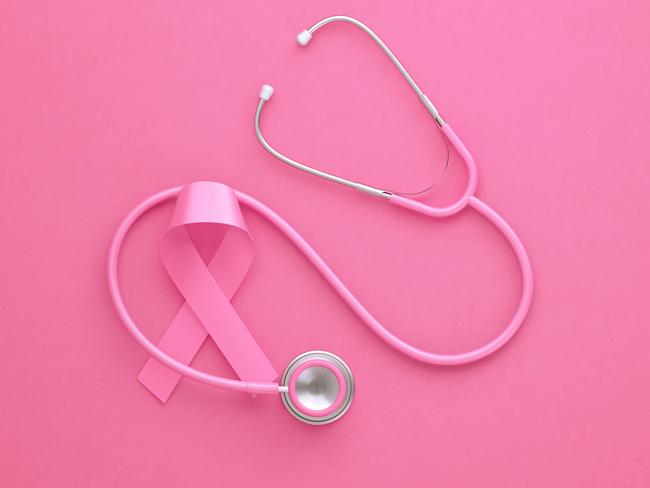 Pink stethoscope and pink breast cancer awareness ribbon on pink background. Horizontal composition with copy space. Breast cancer awareness month concept.