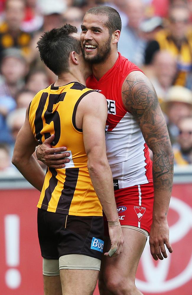 Former teammates Luke Hodge and Lance Frankln share a moment during the Grand Final. Picture: Phil Hillyard