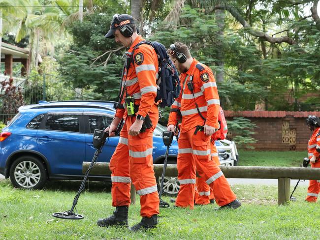 SES searching nearby bushland with metal detectors. Picture: Liam Kidston.