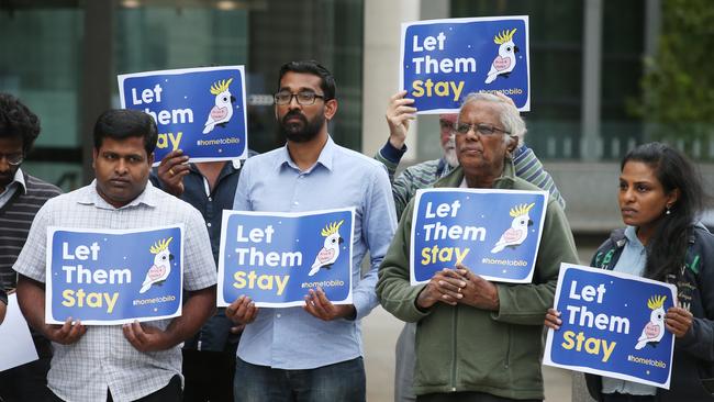 A group of supporters for the Tamil family facing deportation are seen in front of the Federal Court of Australia in Melbourne on February 25. Picture: AAP Image/David Crosling