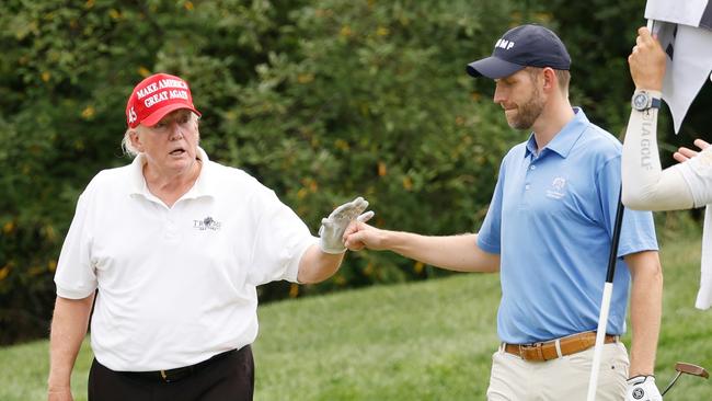 The old high-five/fist-bump. Cliff Hawkins/Getty Images/AFP