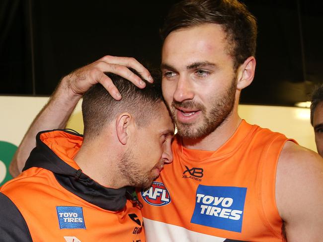 AFL. First Preliminary Final. 21/09/2019. Collingwood v GWS Giants at the MCG.  Brett Deledio hugs teammate Jeremy Finlayson after game    . Pic: Michael Klein.