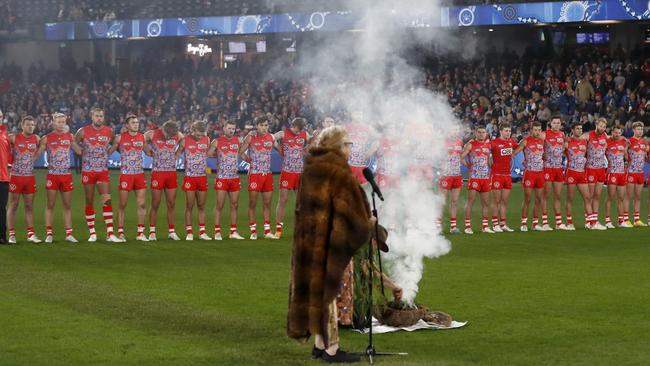 Swans players line up for the Welcome to Country by Senior Wurundjeri elder Aunty Joy Murphy Wandin at Marvel Stadium. Picture: Darrian Traynor/AFL Photos