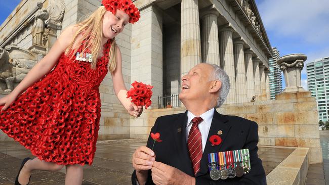 Vietnam Veteran Simon Bloomer and his granddaughter Ruby, 8, at the Shrine in Melbourne, for Remembrance Day in 2014.