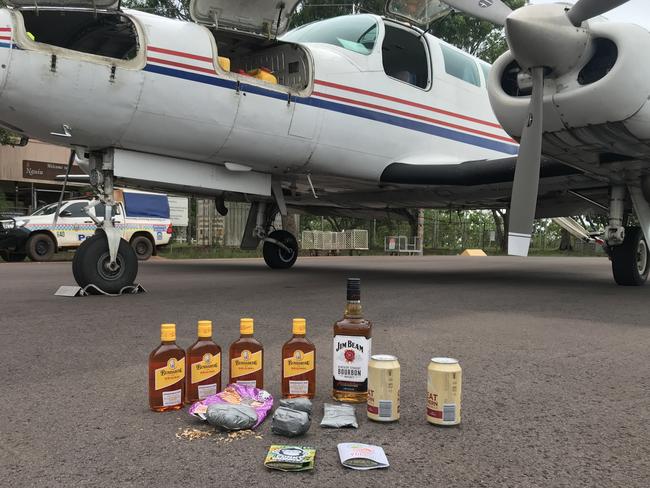 Police seized 72 grams of cannabis, 20 grams of synthetic cannabis and four litres of alcohol from the plane. Picture: NT Police