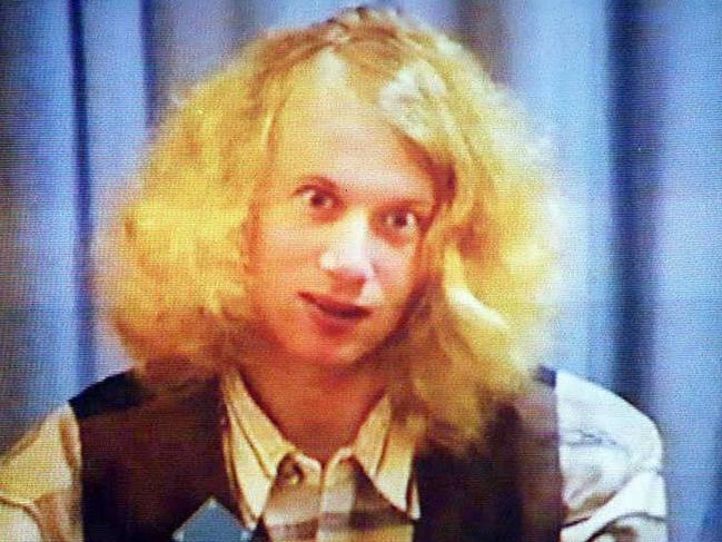 May 22, 1996. Gunman Martin Bryant appears on video screen during a court hearing following the shooting. He would be given 35 life sentences without the possibility of parole.