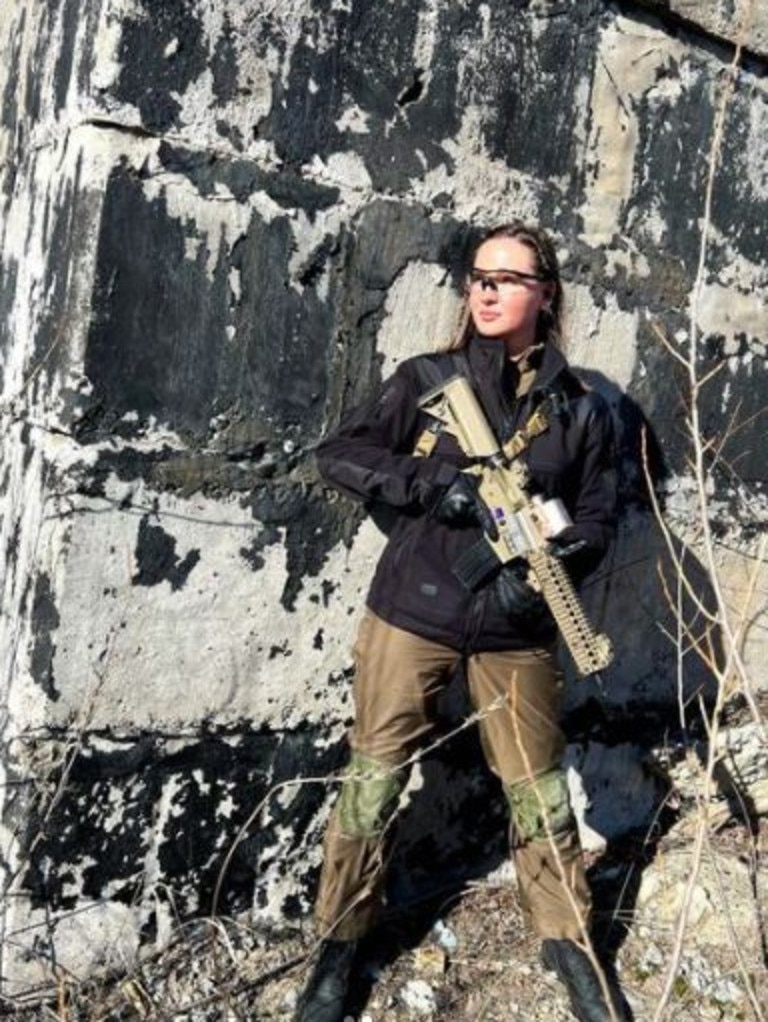 Anastasia Lenna poses with a gun. Picture: Instagram