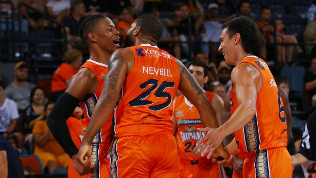 Scott Machado and Jarrod Kenny congratulate DJ Newbill on making a basket in the National Basketball League (NBL) match between the Cairns Taipans and the New Zealand Breakers, held at the Cairns Convention Centre. PICTURE: BRENDAN RADKE.