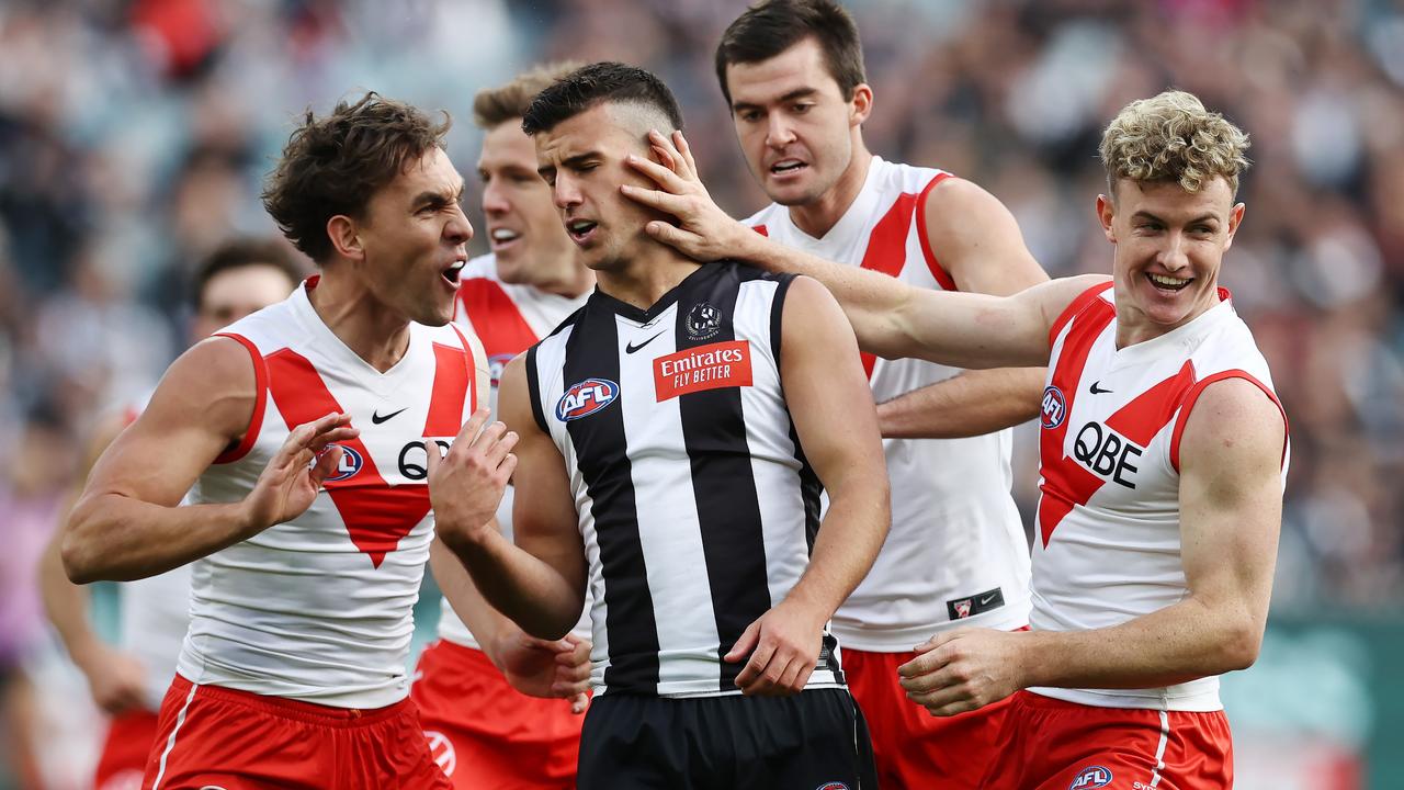 Swans players get stuck into Nick Daicos of the Magpies after a Ryan Clarke goal. Picture: Michael Klein