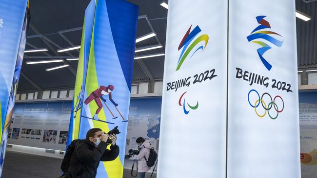 A journalist takes pictures of a display at the exhibition centre for the Beijing 2022 Winter Olympics in Yaqing district. Picture: Getty