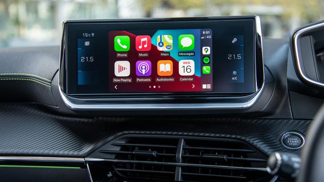 A compact infotainment screen has Apple CarPlay and Android Auto.