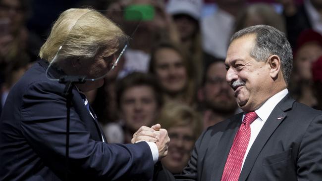 Andrew Liveris on a campaign stage with Donald Trump.