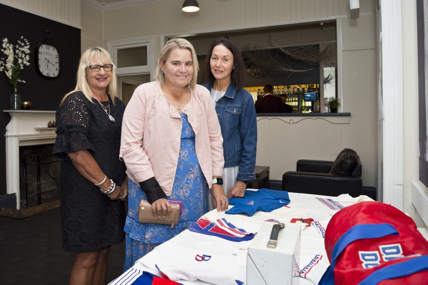 Checking out sporting memorabilia are (from left) Tammy Kavney, Lydia Nestor and Jude Nestor at the Darling Downs School Sport 40th anniversary dinner at Urban Grounds Cafe, Friday, March 1, 2019. Picture: Kevin Farmer