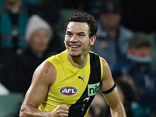 ADELAIDE, AUSTRALIA - AUGUST 06: Daniel Rioli of the Tigers celebrates a goal during the round 21 AFL match between the Port Adelaide Power and the Richmond Tigers at Adelaide Oval on August 06, 2022 in Adelaide, Australia. (Photo by Mark Brake/Getty Images)