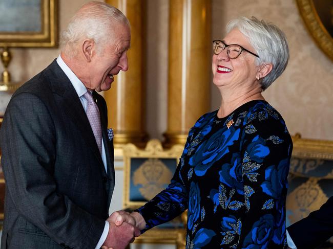 The King shares a joke with Edith Dumont during an audience at Buckingham Palace. Picture: AFP