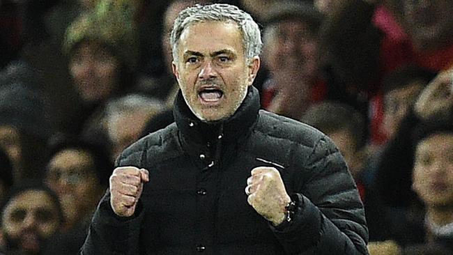 Manchester United's Portuguese manager Jose Mourinho reacts after Manchester United's Belgian midfielder Marouane Fellaini scored his team's second goal during the EFL (English Football League) Cup semi-final football match between Manchester United and Hull City at Old Trafford in Manchester, north west England on January 10, 2017. / AFP PHOTO / Oli SCARFF / RESTRICTED TO EDITORIAL USE. No use with unauthorized audio, video, data, fixture lists, club/league logos or 'live' services. Online in-match use limited to 75 images, no video emulation. No use in betting, games or single club/league/player publications. /